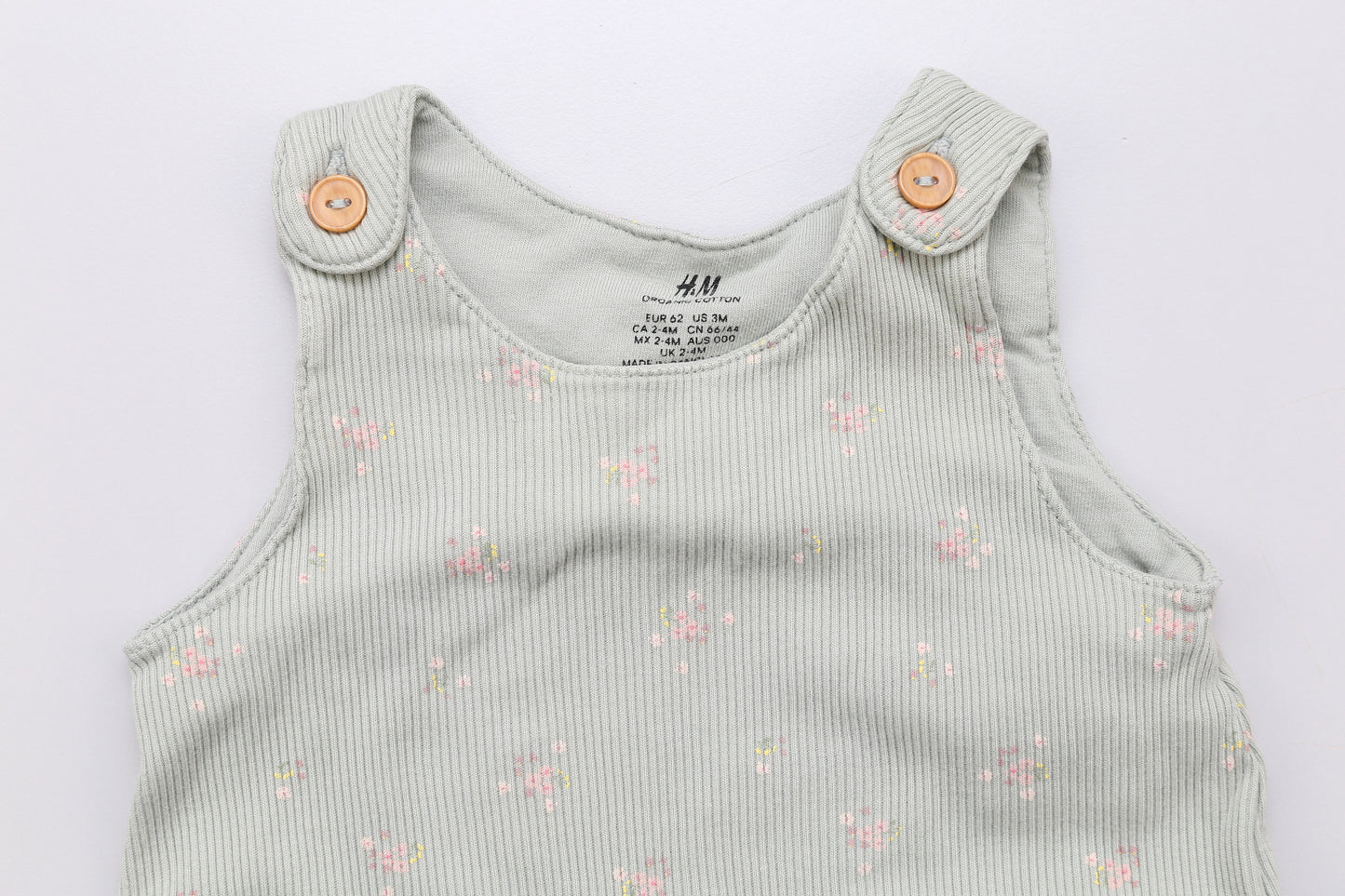 Hellgrüne Latzhose mit kleinen Blumenmuster (62) - KlugeMutti