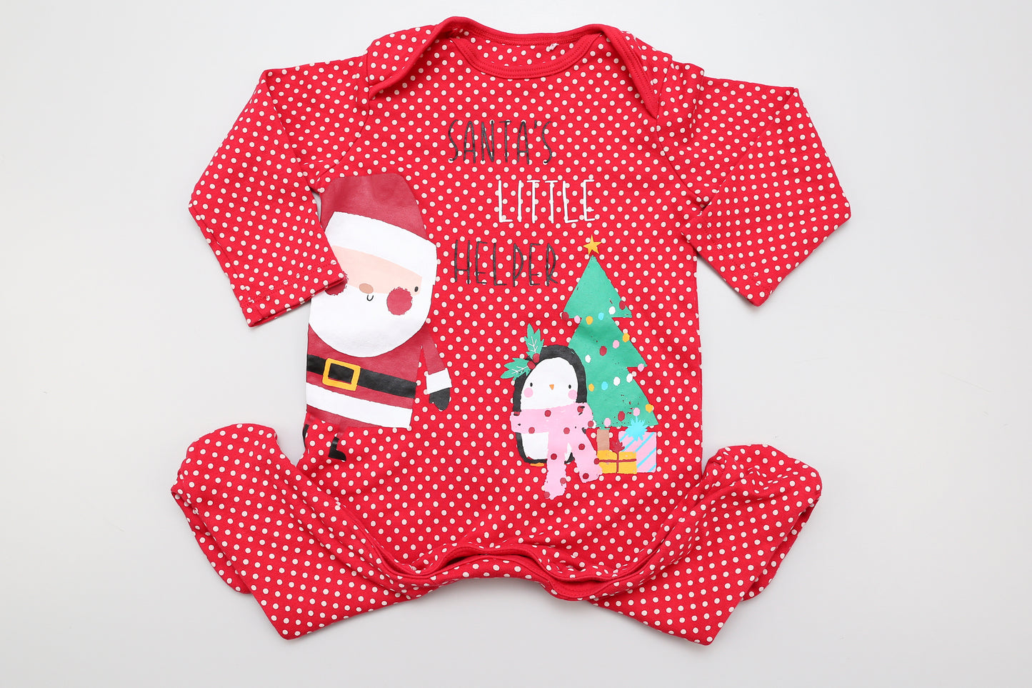 Weihnachtsmotiv-Strampler in Rot mit beigefarbenen Punkten, Druckknöpfen im Schritt.
