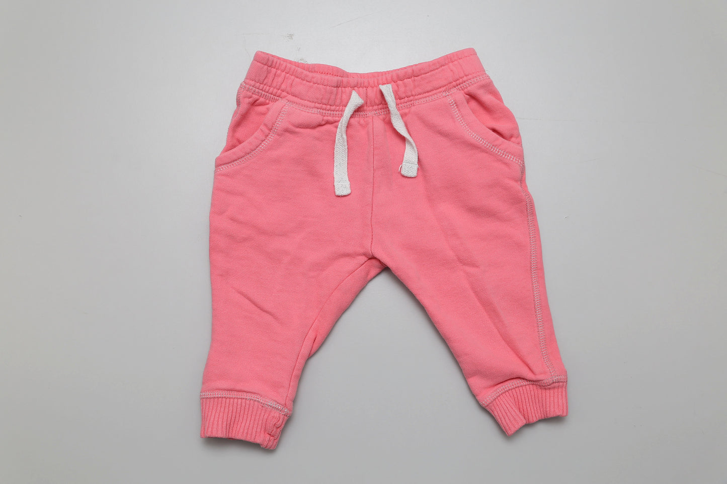 Rosa Sweatpants mit flauschigem Innenfutter und Kordelzug, Größe 80.